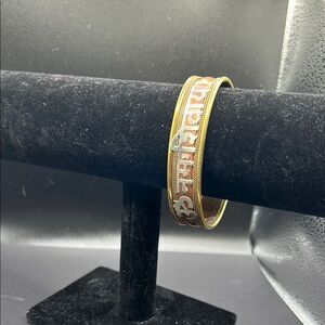 Beautiful vintage brass cuff bracelet with Sanskrit and red stones.